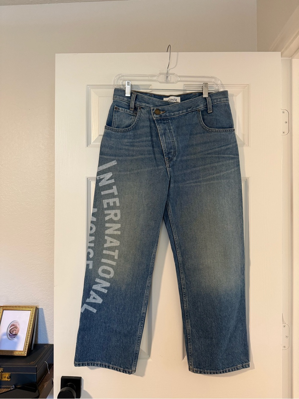 MONSE Straight-Leg Blue Denim Jeans with White Side 'INTERNATIONAL' Print